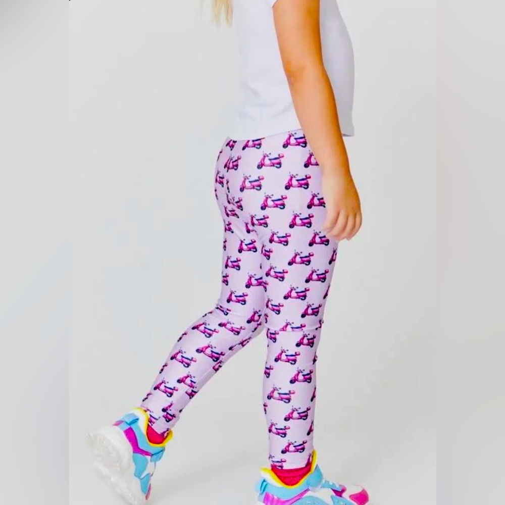 Unworn, NWT Vespa-patterned Terez leggings in pink. Girls’ size 10/12.